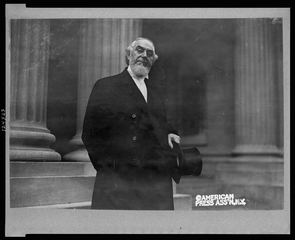 pastor-charles-taze-half-length-portrait-standing-facing-slightly-right-holding.jpg